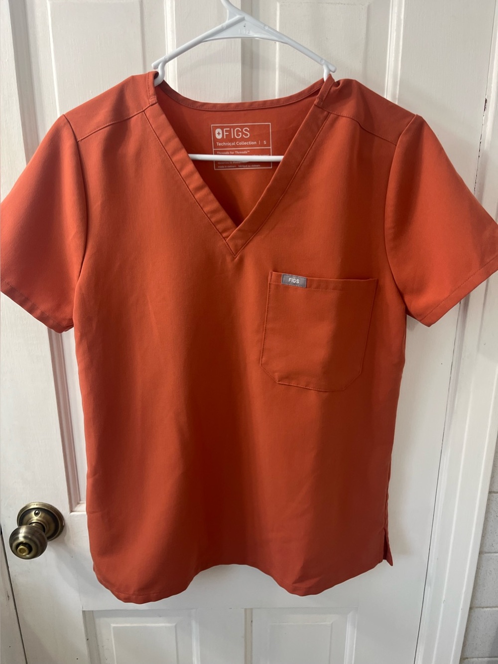 FIGS Women's Catarina One-Pocket Scrub Top. Limited Edition color Terracotta.SM